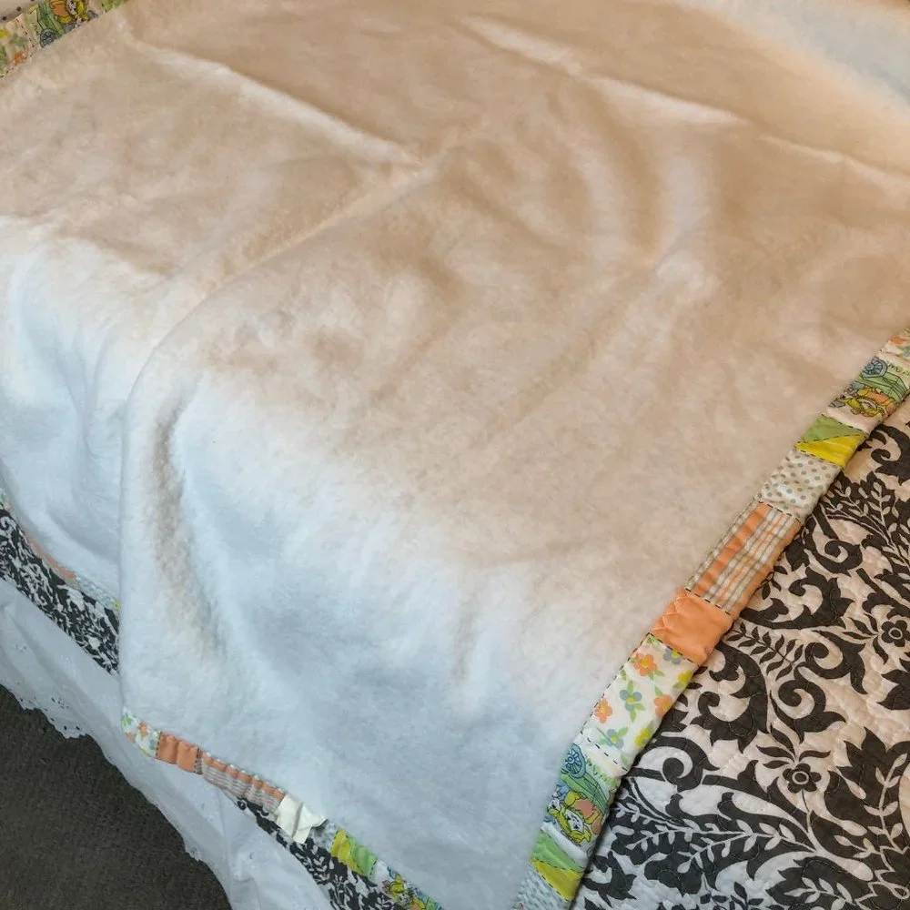 Four vintage 1980s baby blankets